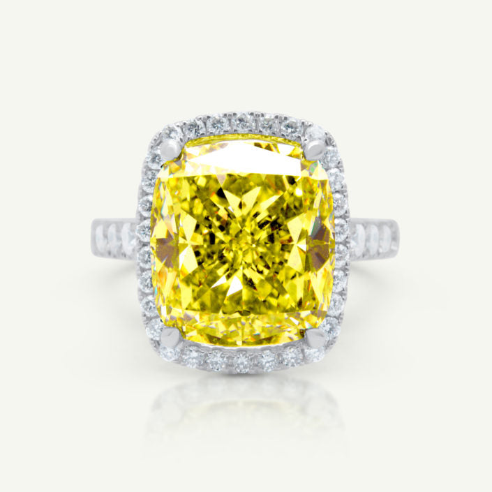 yellow cushion cut diamond engagement ring with halo setting