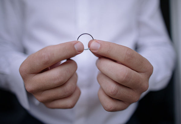 Closeup of a Man holding a ring with two hands