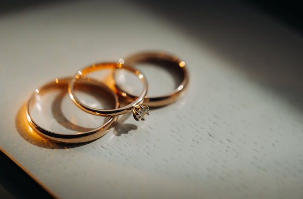 Just Gold Jewellery - close up of two gold wedding rings for a wedding