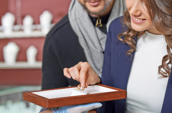 Couple choosing a ring in a jewellery store