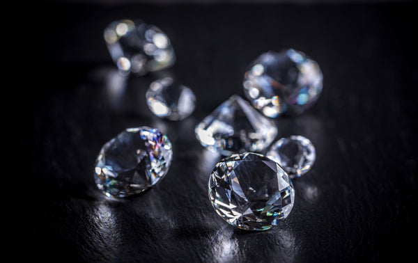 scattering of diamonds on a black background