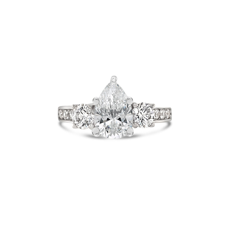 Pear cut diamond three stone engagement ring