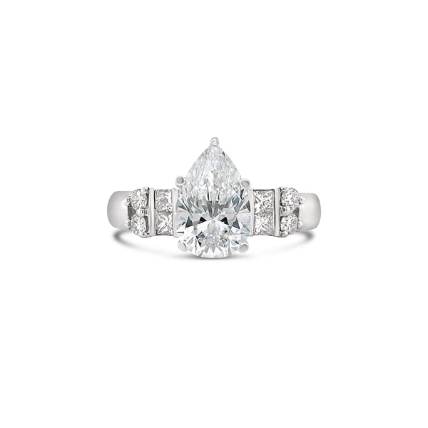 Pear cut diamond engagement ring with princess cut diamond side stones