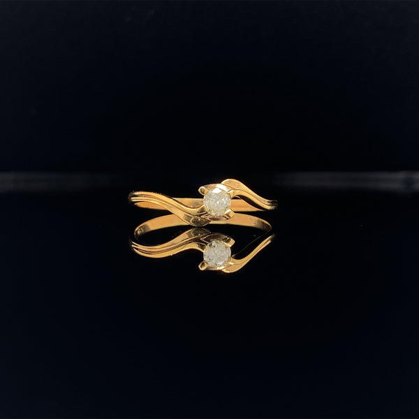 yellow gold four prong diamond twist ring