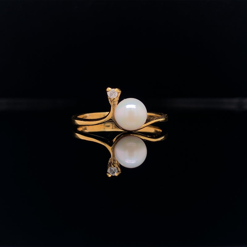 yellow gold pearl and diamond surprise ring