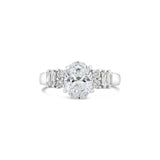 OVAL CUT DIAMOND RING WITH BAGUETTE AND ROUND BRILLIANT SIDE DIAMONDS