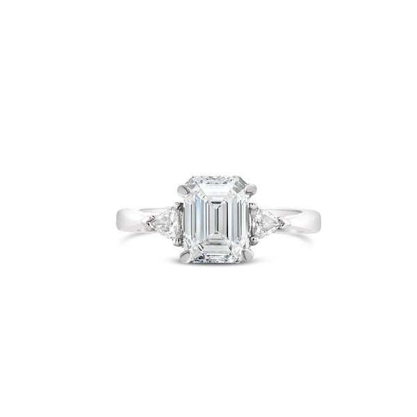 Timeless Three stone emerald cut diamond engagement ring